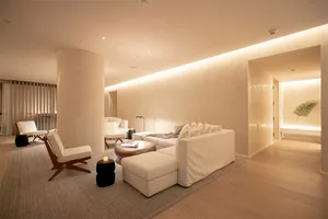 A modern minimalist living room with neutral-tone materials and a serene atmosphere.