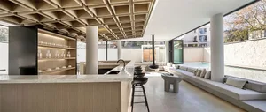 Modern, residential interior space with concrete and marble materials.