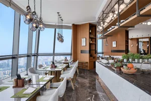 Modern restaurant interior with glass walls, wooden furnishings, and an open floor plan