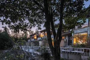 A rustic residential exterior with wooden elements.