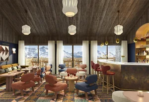A modern bar lounge with wooden features, comfortable seating, and a view of snowy mountains through large windows.
