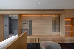 Modern minimalist home interior with wooden finishes and a spacious, open layout.