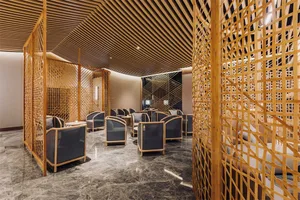 A modern interior lobby featuring wood elements and contemporary furniture.
