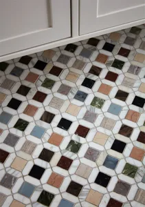 A patterned mosaic floor made of various marble tiles