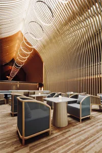 A modern restaurant bar featuring a textured wood interior design.