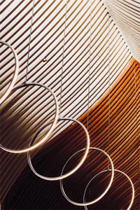 Metallic hanging rings in a minimalist interior design setting.
