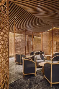 A minimalist restaurant interior with wooden architecture and furniture.