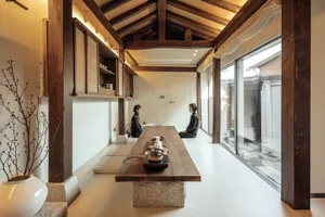 A minimalist coffee shop featuring a wooden counter and floor.