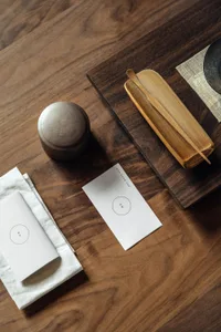 Minimalist-style tableware set displayed on a wooden board.