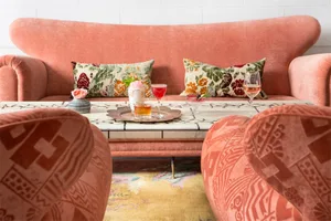 Modern love seat with floral pattern in a contemporary living room setting