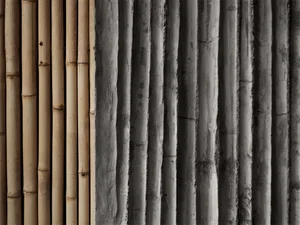 Bamboo poles arranged in lines against a textured wall.