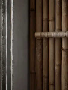 Dark, industrial-style interior space featuring bamboo decor elements.