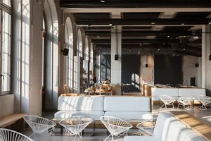 Modern industrial restaurant interior with concrete design elements.