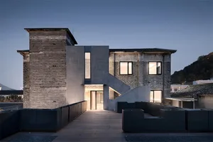A modern building constructed with concrete and brick materials.