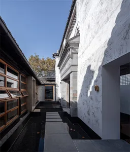 Residential interior featuring concrete, wood, and glass materials.