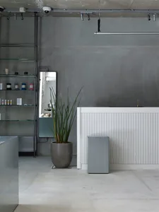 Industrial retail store interior with concrete walls and minimalist design
