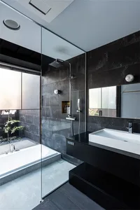 Modern bathroom featuring concrete tiles and minimalist design.