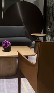 Modern hotel lounge featuring wood, leather, and metal materials