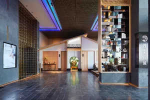 A modern retail storefront featuring minimalist design elements with concrete and wood materials.