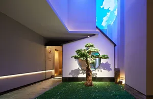 A modern interior design featuring glass windows and concrete walls.