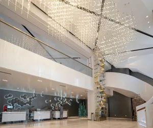 A modern lobby interior featuring circular patterns and contemporary materials.