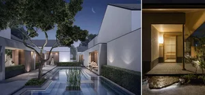 Modern minimalist interior space featuring elegant lighting design and white walls with natural light.