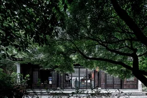 A traditional retail storefront with wood, metal, and glass materials.