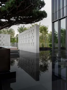 Modern architectural design featuring concrete and terrazzo materials.