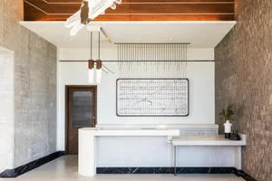 Modern lobby with marble accents and concrete walls