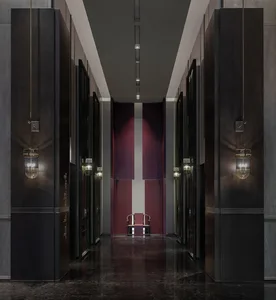 A modern interior corridor with a marble floor and dark wood walls.