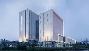 A modern office building with glass and concrete materials.