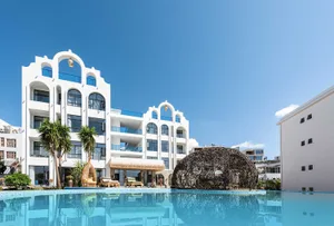 Modern apartment building with concrete exterior and swimming pool