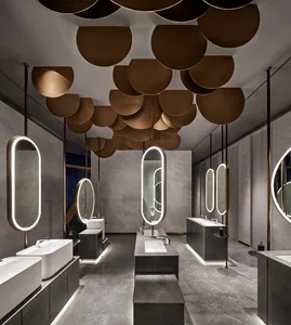 Interior design of a modern bathroom with concrete and glass materials.