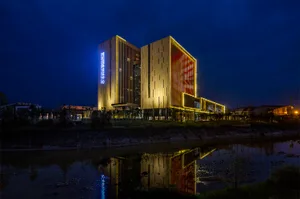 A modern conference center with glass and steel exterior.