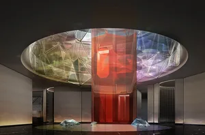 Modern glass lobby interior with geometric shapes and colorful lights.
