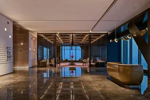 Modern hotel reception area with marble and glass materials
