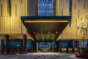 Modern lobby featuring glass walls and interior design elements.