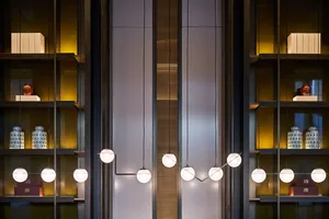 Modern minimalist interior with glass lighting elements.