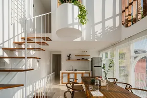 A modern living space featuring wood and glass materials.