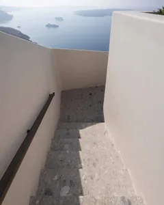 Marble staircase with a view of the sea.