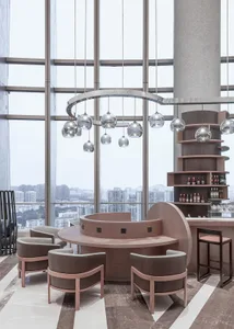 Modern coffee shop interior featuring concrete and glass materials.