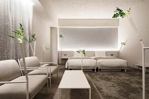 A modern minimalist living room featuring sleek furniture, contemporary decor, and sophisticated technology.