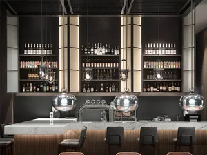 Modern bar interior with metallic lighting and marble counter.