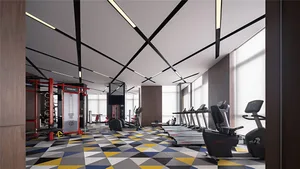 A spacious modern gym with metallic finishes and industrial design elements.