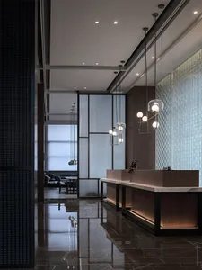 Modern hotel lobby featuring glass partitions, marble countertops, and wooden furniture.