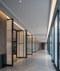 Modern interior design featuring glass partitions and metal railings in a long corridor hallway.