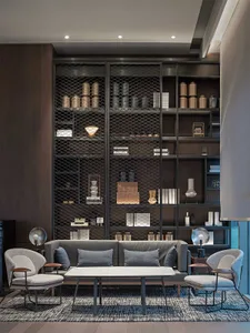Modern lobby with metal shelving and lighting fixtures.