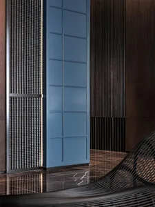 Modern lobby featuring metal and wood materials.