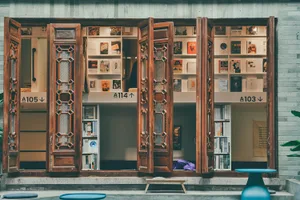 A traditional bookstore interior with wooden and glass elements.