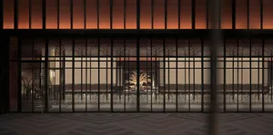 A minimalist storefront with a metallic frame and patina finish.